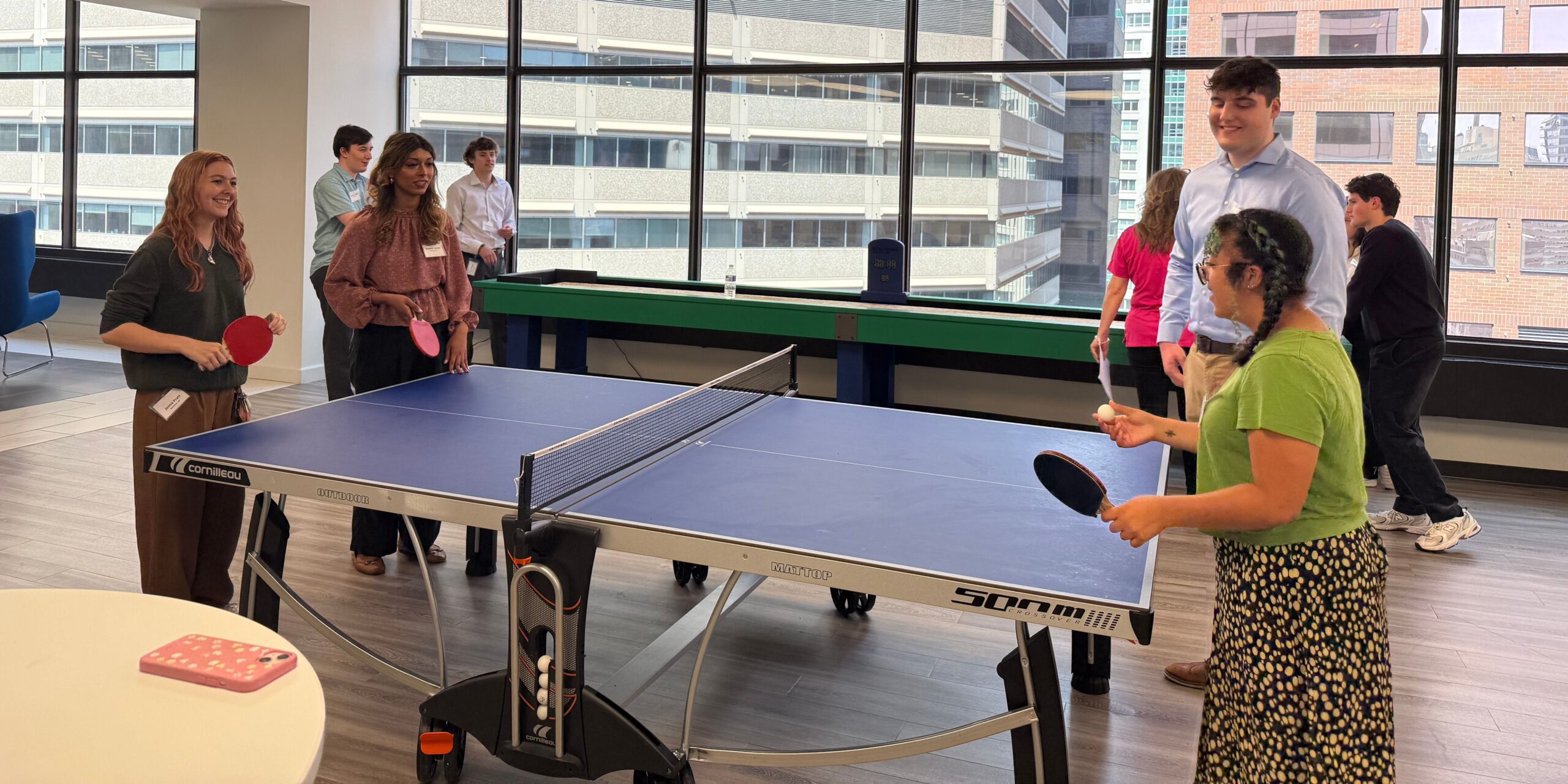 Interns playing doubles ping-pong at our Philadelphia headquarters.