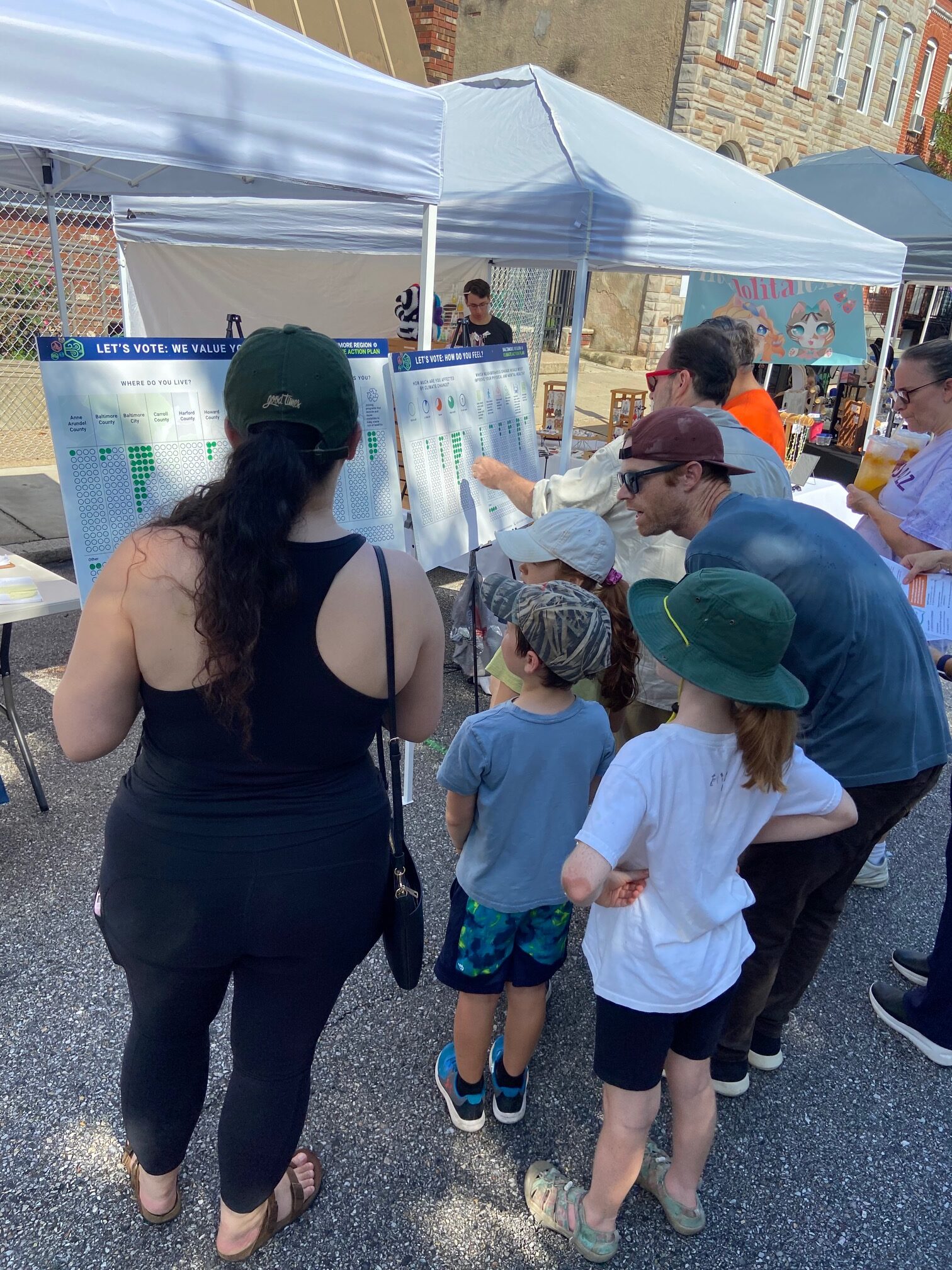 Community members provide feedback at a popup event.
